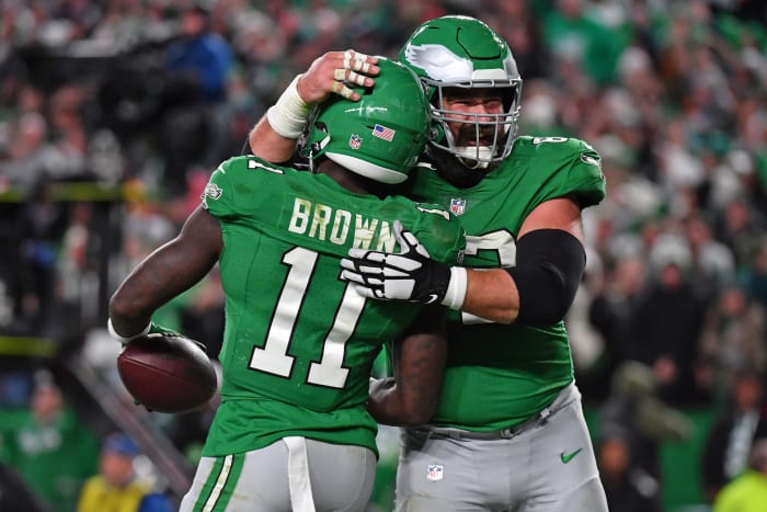 Receiver A.J. Brown and center Jason Kelce model the Philadelphia Eagles Kelly Green uniforms.